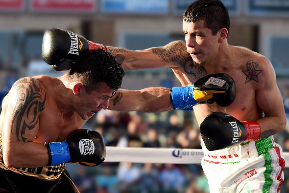 Flores won the title by beating via split decision tiny (5'1½") but tough Oscar Escandon in April. (Photo: Getty Images)