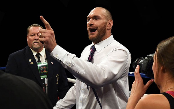 WBA/WBO champ Fury stormed the ring after Wilder’s KO victory and created a WWE-like scene. (Photo: Getty Images)